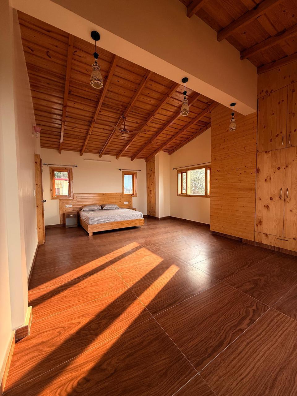 Wood-panelled bedroom interior of the cottage